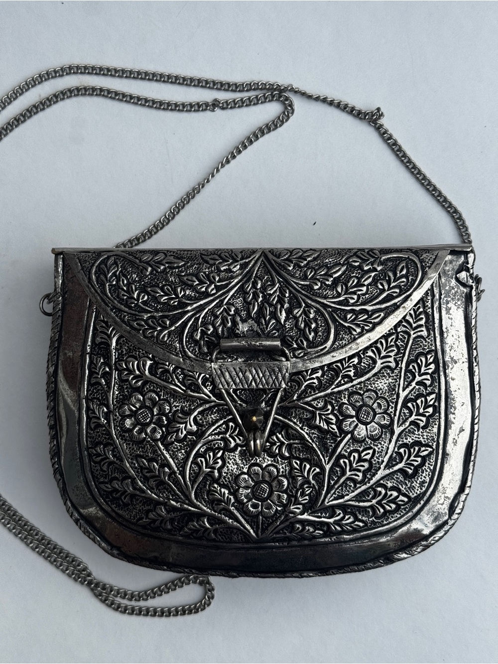 From St Xavier Embossed Metal Floral Crossbody Clutch Silver